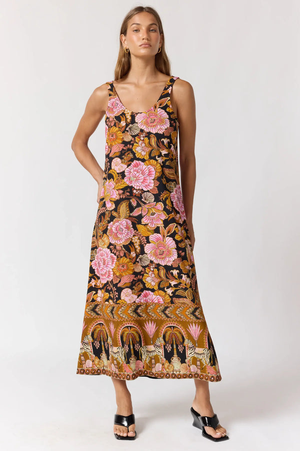 Woman wearing a floral dress on a white background