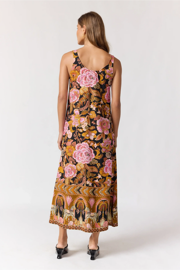 Woman wearing a floral dress on a white background