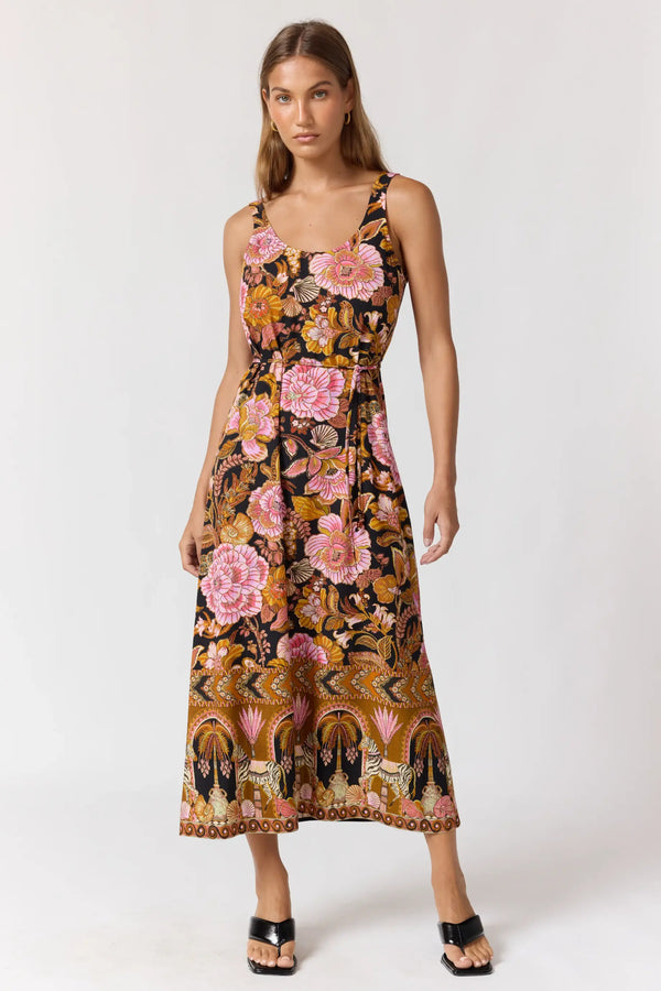 Woman wearing a floral dress on a white background