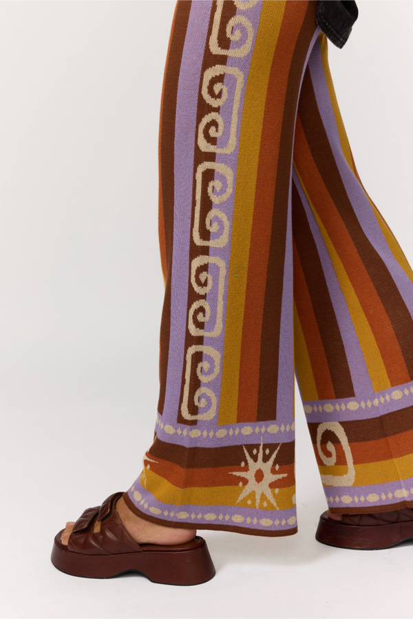 Colorful patterned pants with a white background