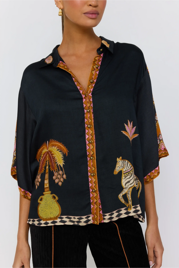 Black blouse with colorful embroidery and patterns on a white background
