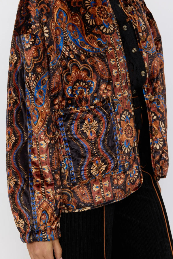 Patterned jacket with a mix of brown, blue, and beige colors on a white background