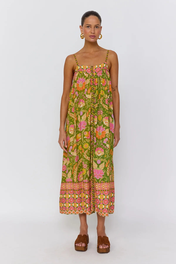 Woman wearing a floral dress on a white background