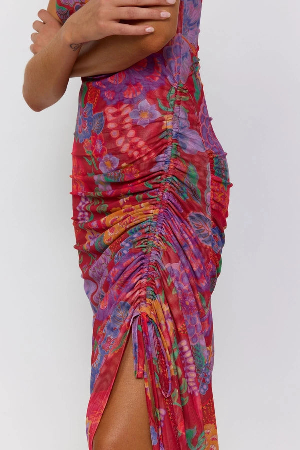 Colorful floral dress with ruched design on a white background