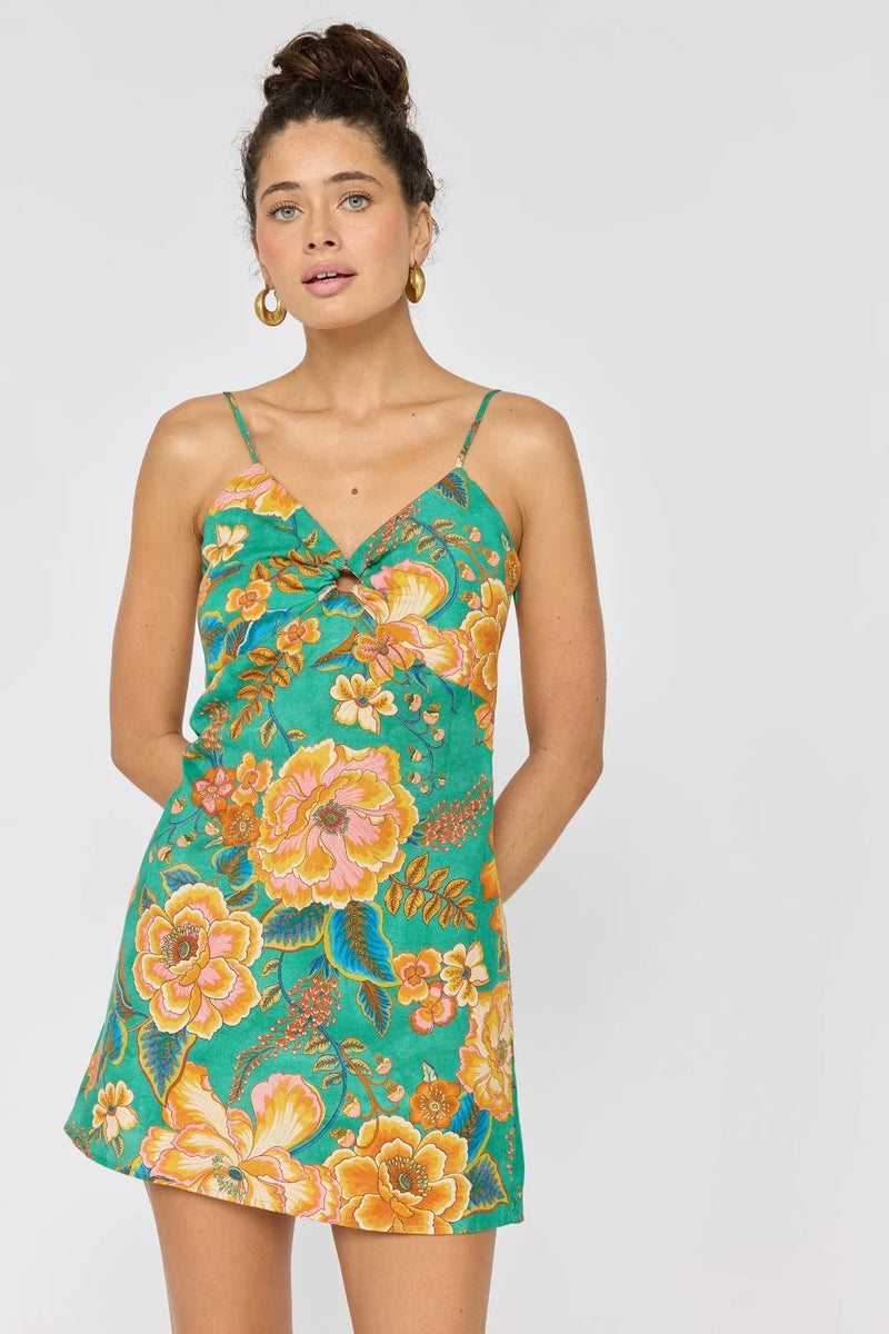 Woman wearing a floral dress with a white background