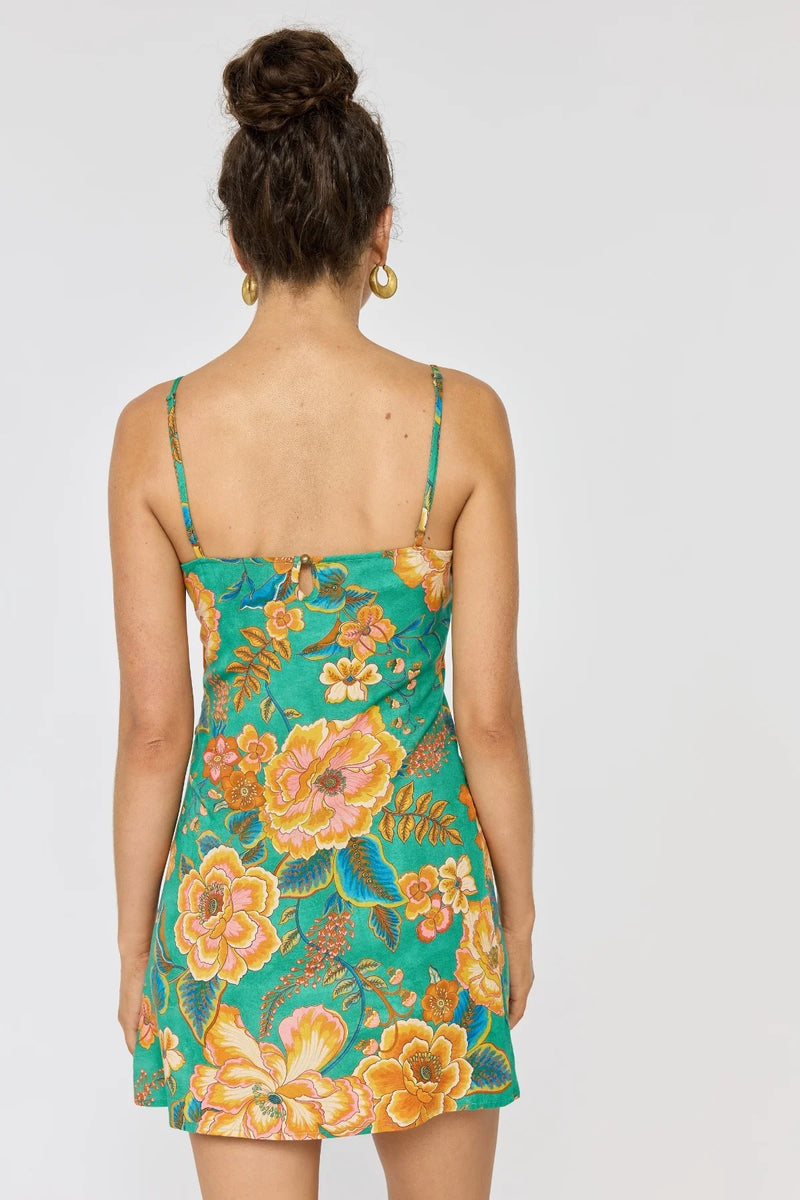 Woman wearing a floral dress with a white background