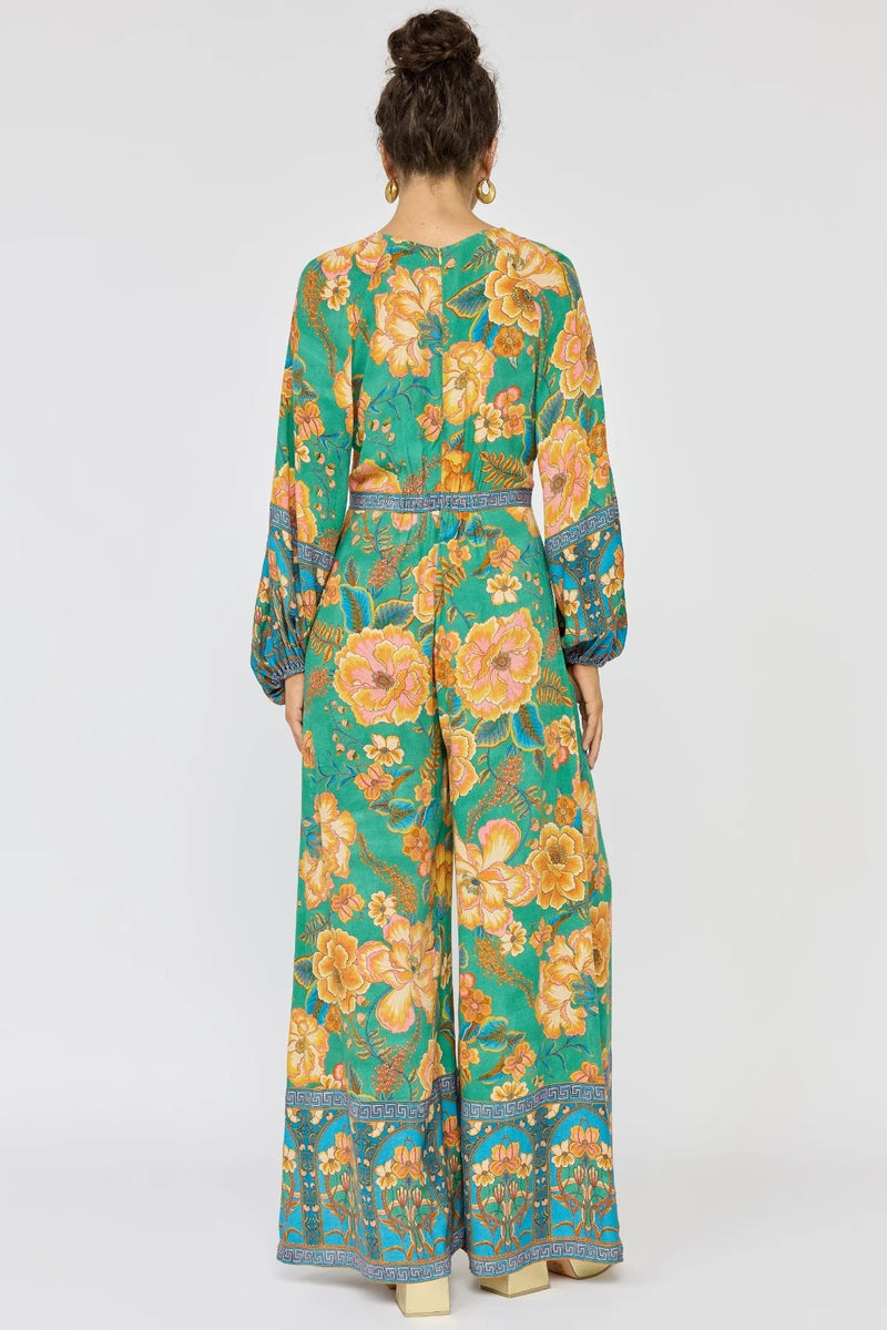 Woman wearing a floral dress with a white background